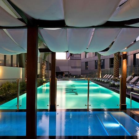 Damac Maison The Vogue Dubai Exteriör bild The pool at the hotel