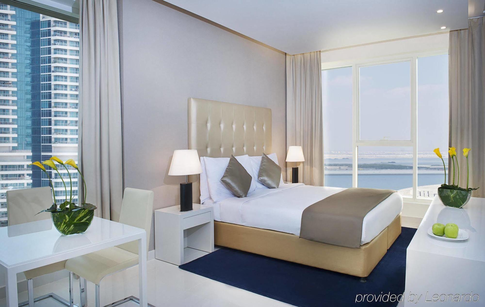 Damac Maison The Vogue Dubai Exteriör bild A bedroom at the Address Downtown Hotel