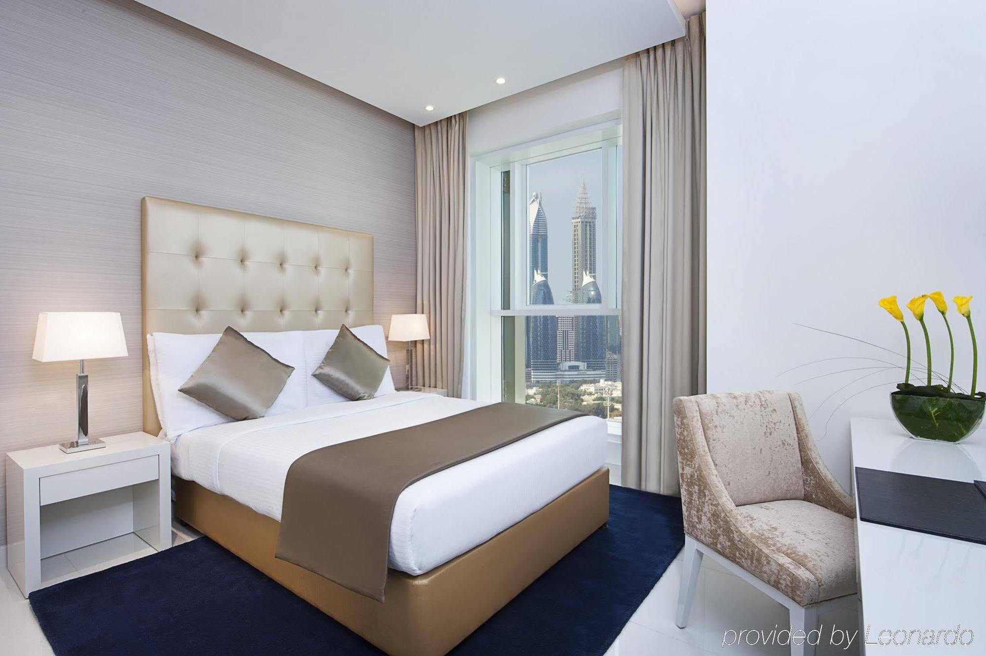 Damac Maison The Vogue Dubai Exteriör bild A bedroom at the hotel