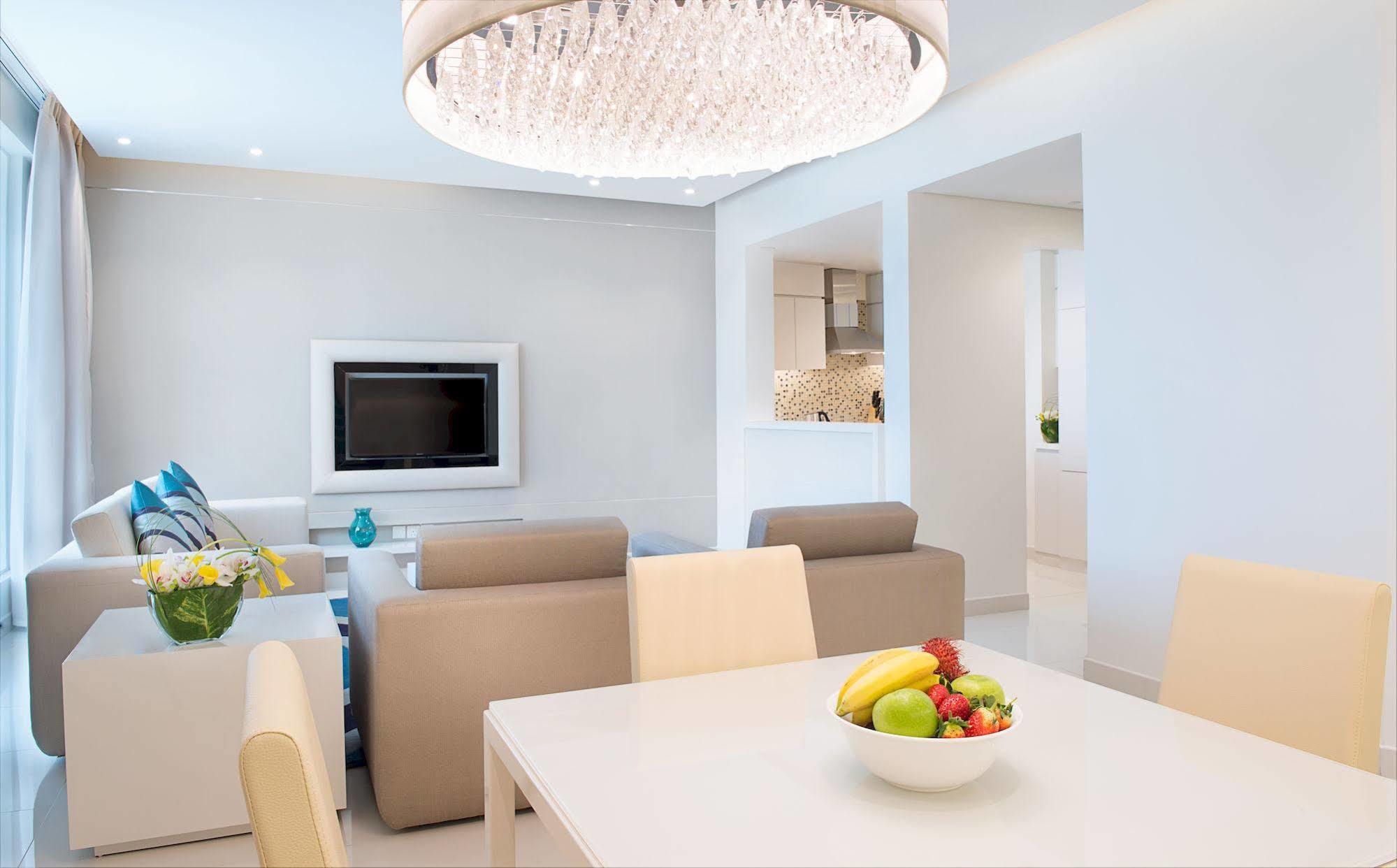 Damac Maison The Vogue Dubai Exteriör bild A living room with a flat screen television