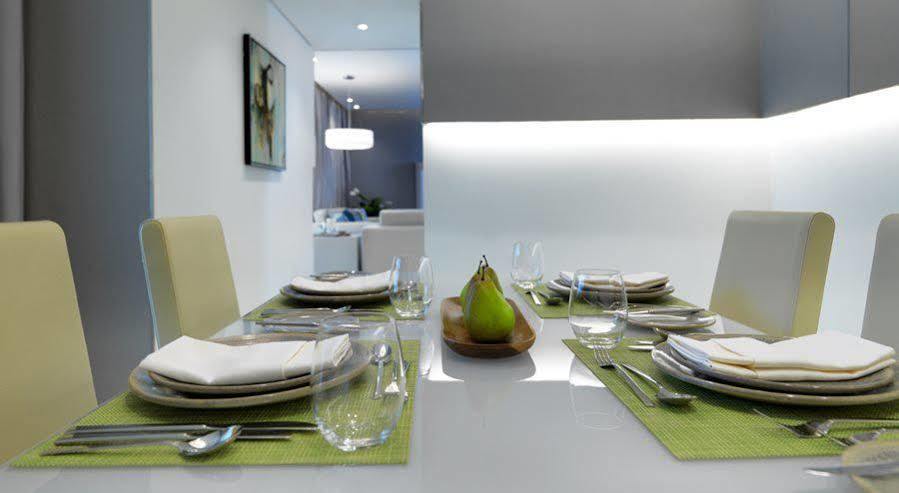 Damac Maison The Vogue Dubai Exteriör bild A table set for a meal