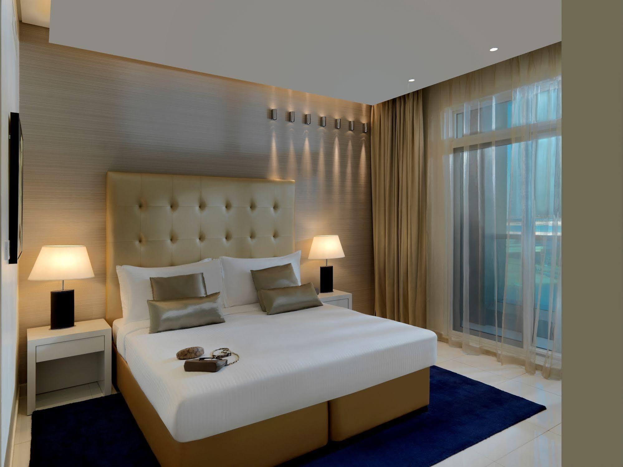 Damac Maison The Vogue Dubai Exteriör bild A bedroom at the hotel